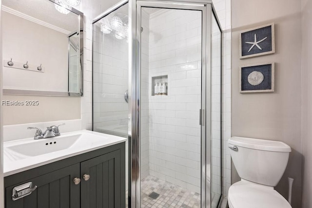 bathroom featuring ornamental molding, vanity, walk in shower, and toilet