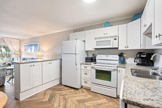 kitchen with sink, white cabinetry, crown molding, white appliances, and light parquet flooring