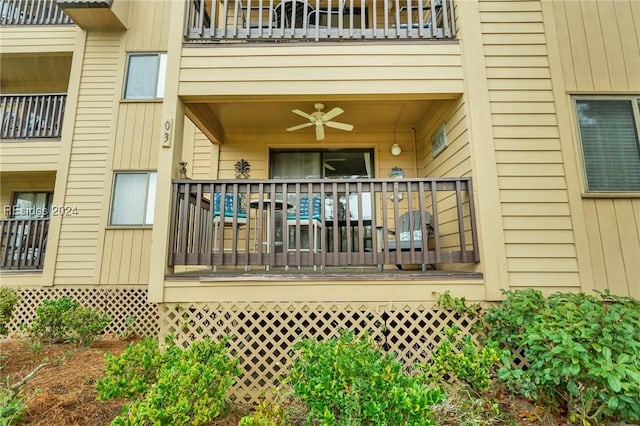 view of exterior entry featuring ceiling fan