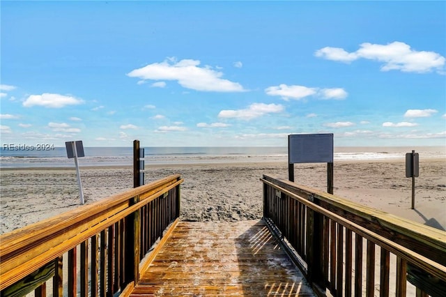 view of property's community with a view of the beach and a water view