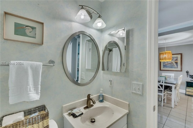 bathroom featuring vanity, crown molding, and tile patterned floors