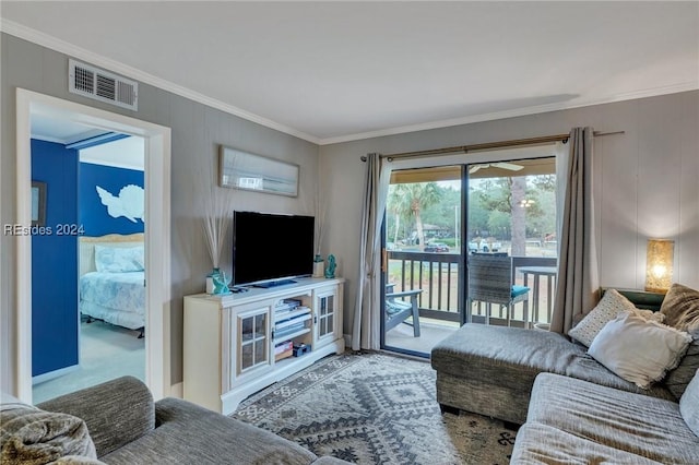 carpeted living room with crown molding