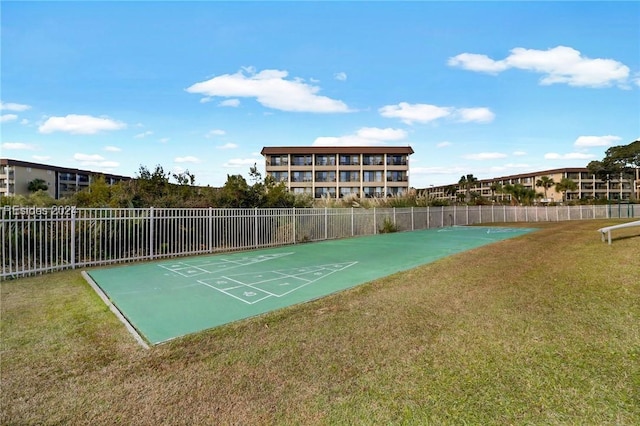 view of home's community with a lawn