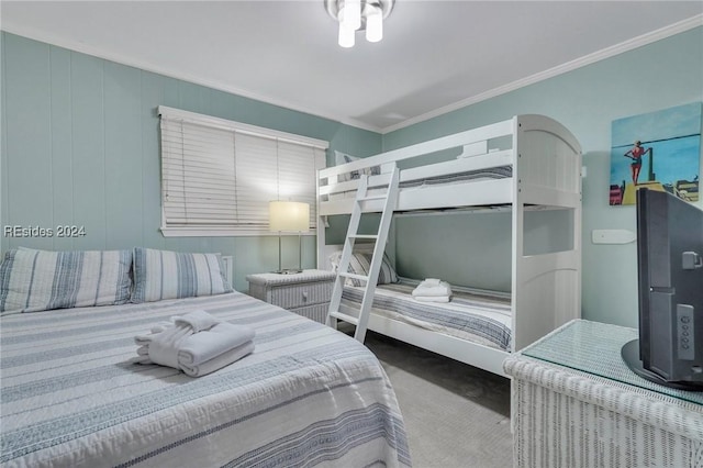 carpeted bedroom with ornamental molding