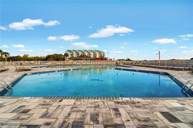 view of swimming pool with a patio