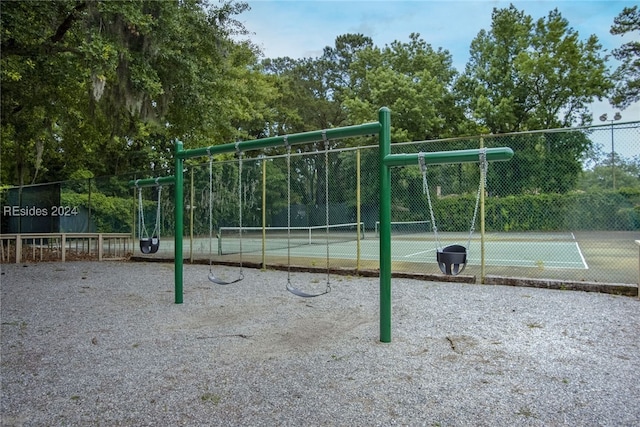 view of playground featuring tennis court