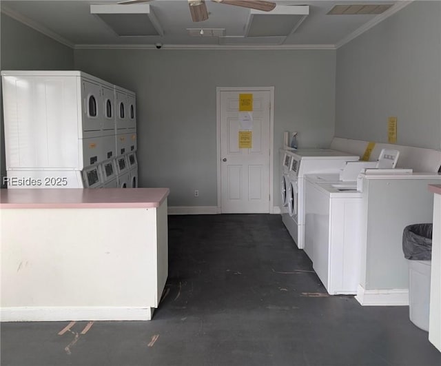 washroom with stacked washer / drying machine and washer and clothes dryer