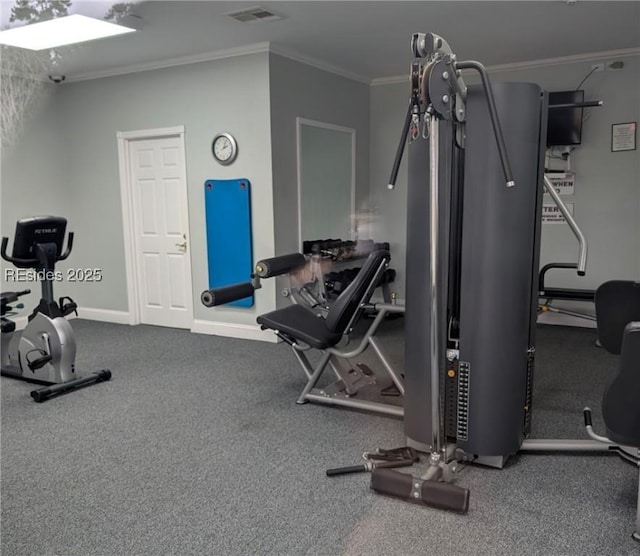 workout area featuring ornamental molding