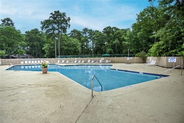 view of pool featuring a patio