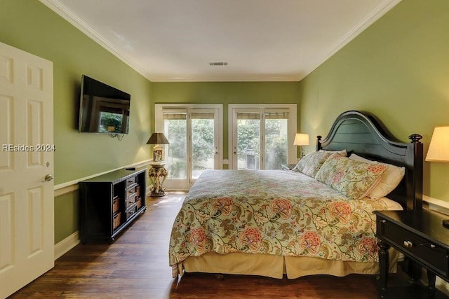 bedroom featuring access to exterior, ornamental molding, and dark hardwood / wood-style floors