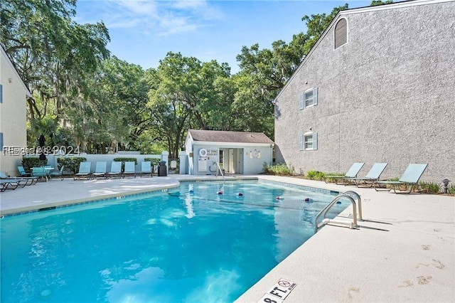 view of pool featuring a patio