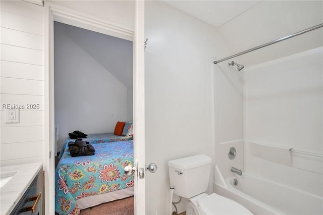 full bathroom featuring shower / bathtub combination, vanity, and toilet