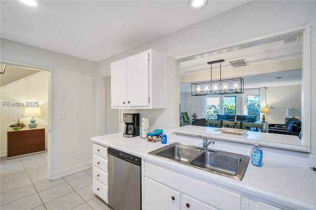 kitchen featuring sink, hanging light fixtures, white cabinets, light tile patterned flooring, and stainless steel dishwasher