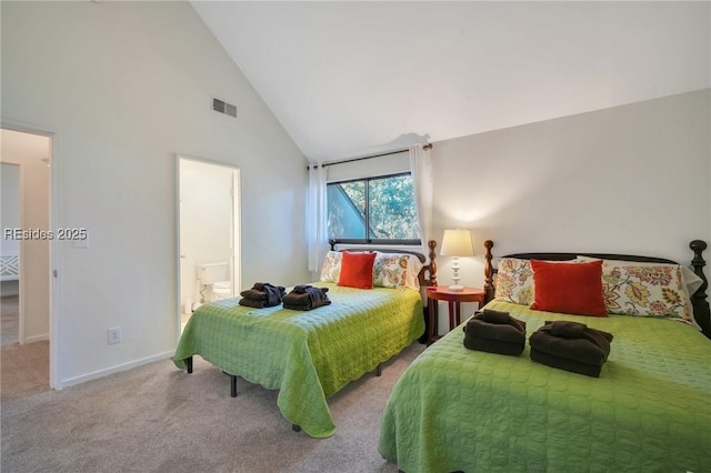 carpeted bedroom featuring connected bathroom and high vaulted ceiling