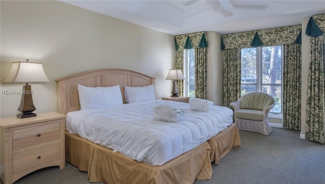 bedroom with light colored carpet and ceiling fan