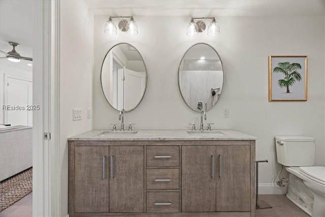 bathroom with vanity, tile patterned floors, ceiling fan, and toilet