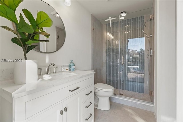 bathroom featuring vanity, tile patterned flooring, a shower with door, and toilet