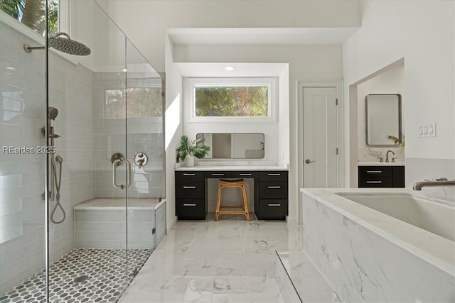 bathroom with vanity and an enclosed shower