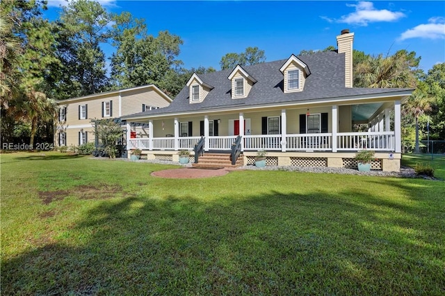 farmhouse inspired home featuring covered porch and a front lawn