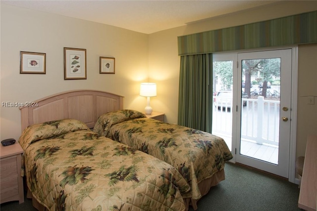 bedroom featuring dark colored carpet and access to outside