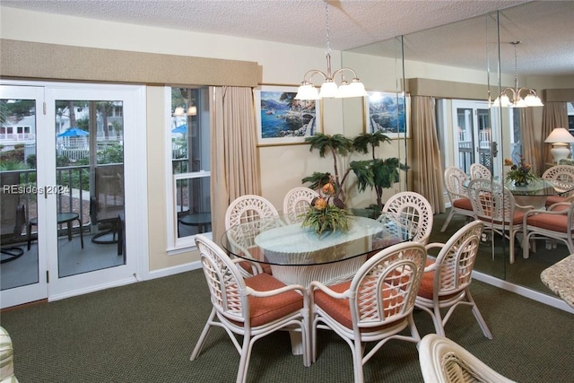 carpeted dining space with an inviting chandelier and a textured ceiling