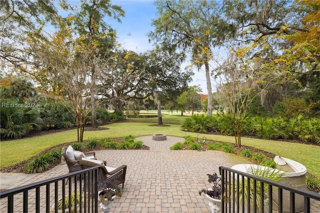 view of patio / terrace with an outdoor fire pit