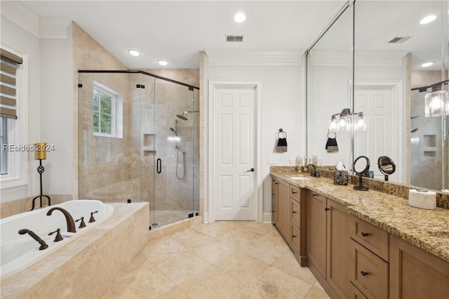 bathroom with ornamental molding, separate shower and tub, and vanity