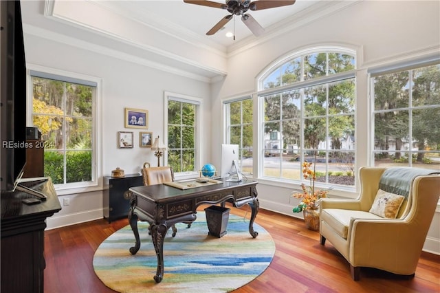 home office featuring wood-type flooring, crown molding, and ceiling fan