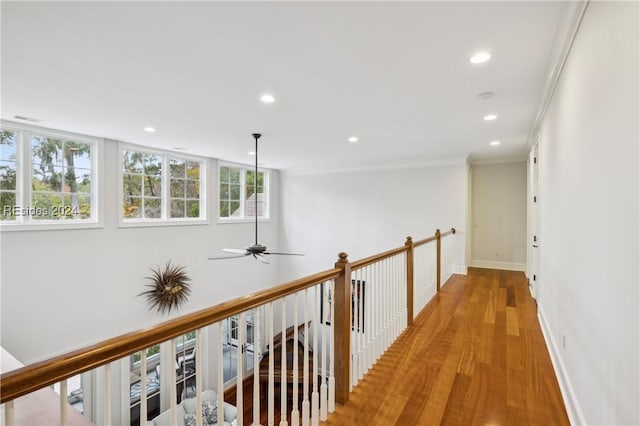 hallway featuring light hardwood / wood-style flooring and ornamental molding