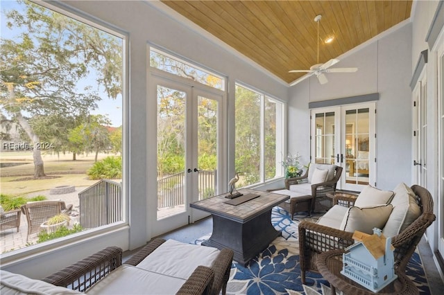 sunroom with french doors, a wealth of natural light, vaulted ceiling, and wooden ceiling