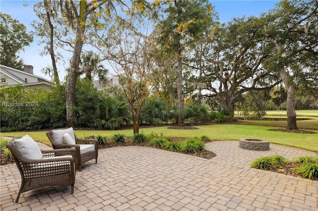 view of patio featuring an outdoor fire pit