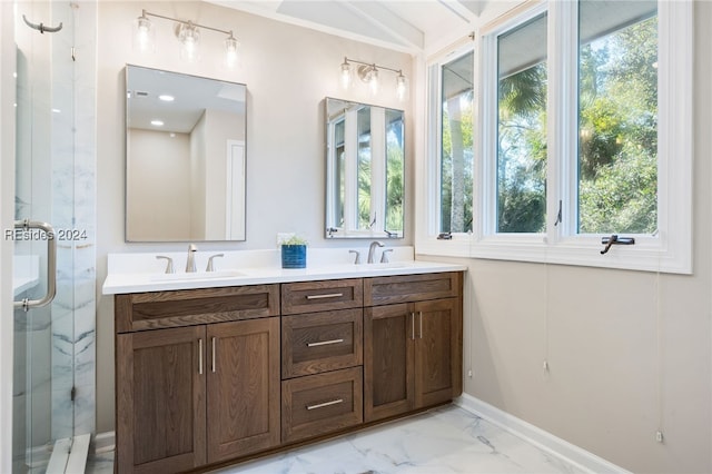 bathroom with a shower with door and vanity