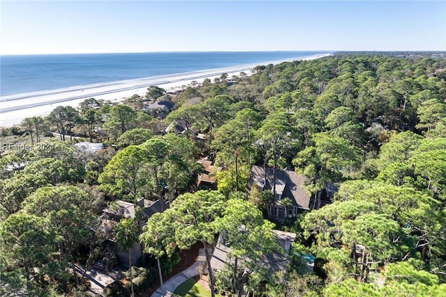 drone / aerial view featuring a water view and a view of the beach