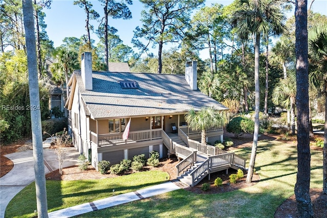 view of front of home with a front lawn and covered porch