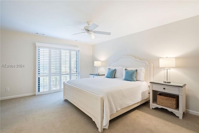 carpeted bedroom featuring ceiling fan and access to outside