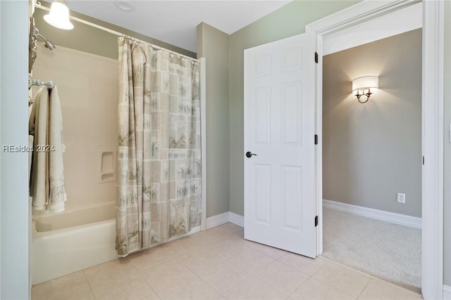 bathroom with tile patterned floors and shower / bath combination with curtain