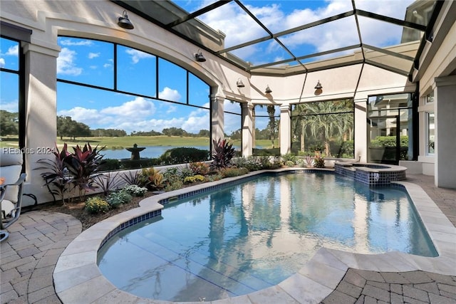 view of pool featuring an in ground hot tub, a water view, a patio area, and a lanai