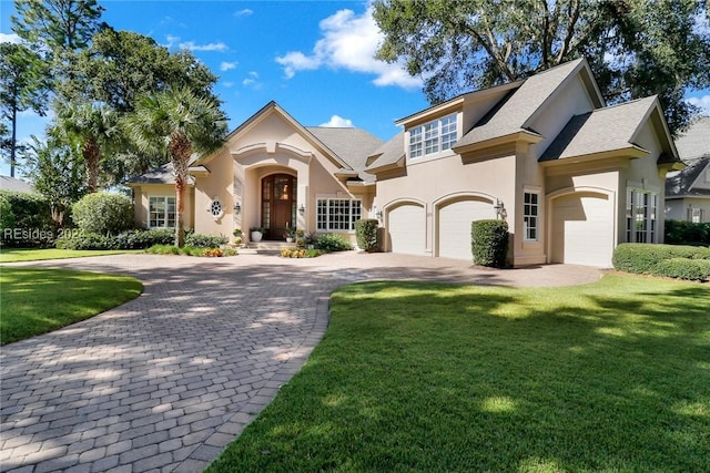 view of front of house featuring a garage and a front yard