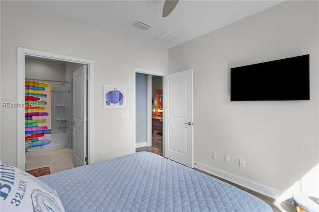 bedroom featuring hardwood / wood-style flooring, ceiling fan, and ensuite bathroom