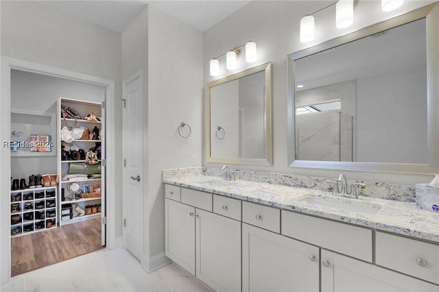 bathroom with vanity and walk in shower