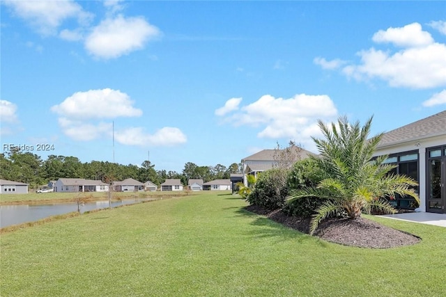 view of yard with a water view