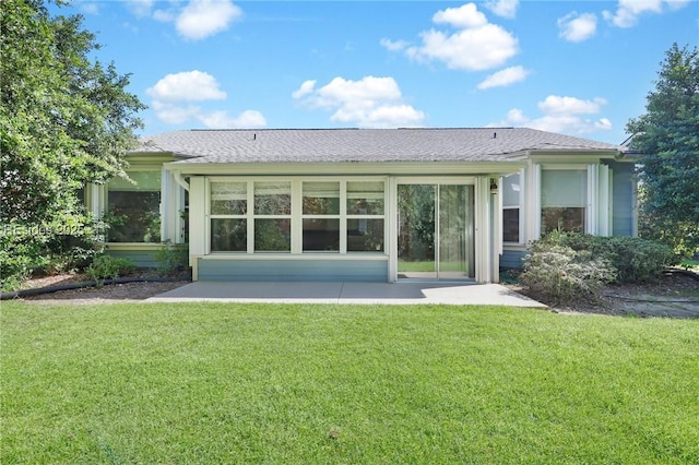 back of house featuring a yard and a patio area