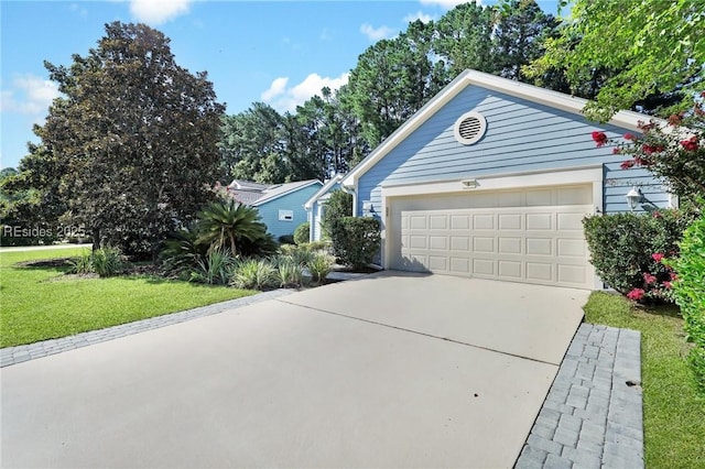 ranch-style home with a garage and a front yard