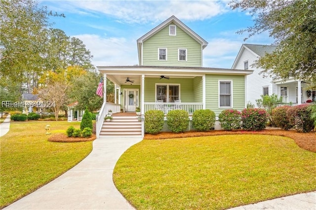 view of front of property with ceiling fan, a porch, and a front yard