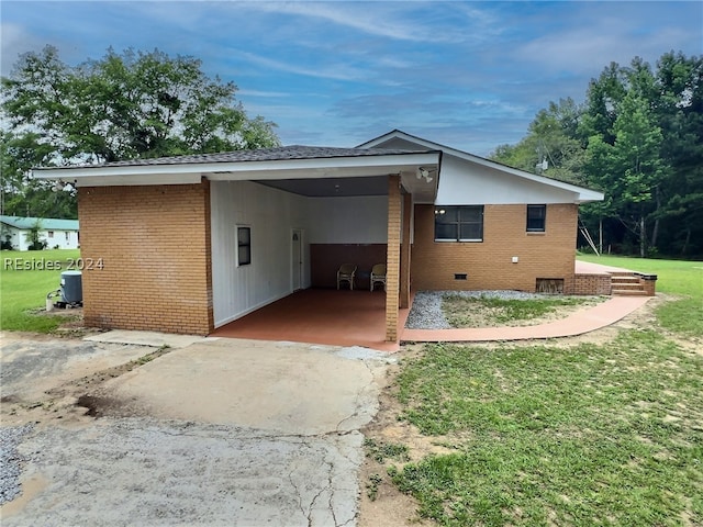 rear view of house with a carport