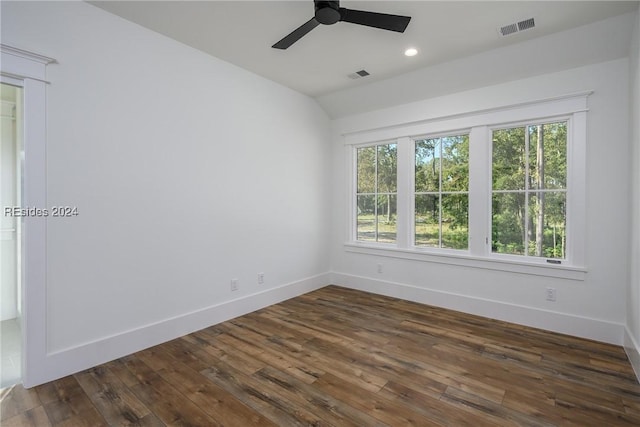 unfurnished room with lofted ceiling, dark hardwood / wood-style floors, and ceiling fan