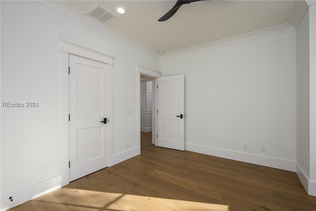 unfurnished bedroom featuring ceiling fan, ornamental molding, and hardwood / wood-style floors