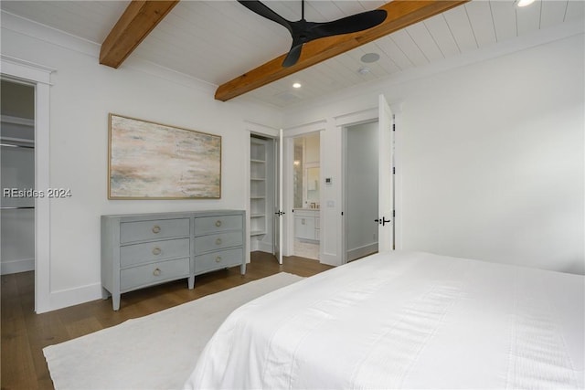 bedroom featuring connected bathroom, beamed ceiling, dark hardwood / wood-style flooring, wood ceiling, and ceiling fan