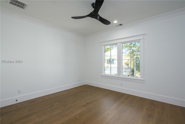 empty room with wood-type flooring, ornamental molding, and ceiling fan