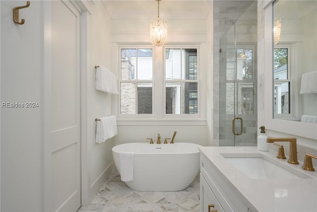 bathroom featuring a notable chandelier, vanity, shower with separate bathtub, and a wealth of natural light